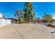 Spacious driveway with mature trees and a walkway leading to the home at 12836 N 60Th St, Scottsdale, AZ 85254