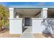 Covered front entry with modern design elements and a sleek front door at 12836 N 60Th St, Scottsdale, AZ 85254