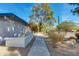 Charming front yard with mature trees, a sidewalk and low wall at 12836 N 60Th St, Scottsdale, AZ 85254