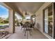 Covered patio area featuring a table, chairs, and a ceiling fan at 13238 W Market St, Surprise, AZ 85374