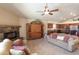 Open-concept living room showcasing a fireplace, built-in cabinet, and access to kitchen at 1363 E Amberwood Dr, Phoenix, AZ 85048