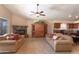 Comfortable living room with a stone fireplace and sliding glass doors to the patio at 1363 E Amberwood Dr, Phoenix, AZ 85048