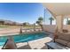 Inviting pool with seating area overlooking the golf course at 1363 E Amberwood Dr, Phoenix, AZ 85048