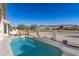 Inviting pool area with desert landscape views and lounge seating at 1363 E Amberwood Dr, Phoenix, AZ 85048