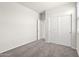 Bedroom featuring carpeted flooring and a closet with sliding doors at 1372 W Hess Ave, Coolidge, AZ 85128