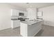 New kitchen featuring a large island, modern appliances, white cabinetry, and granite counters at 1372 W Hess Ave, Coolidge, AZ 85128