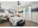 Bedroom featuring a neutral color scheme, a gray accent wall, and light-colored carpet flooring at 1404 W Kennedy Ave, Coolidge, AZ 85128