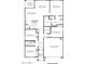 Detailed first-floor plan showcasing layout with bedrooms, bathrooms, kitchen, and garage at 1404 W Kennedy Ave, Coolidge, AZ 85128