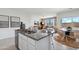 Bright kitchen island view shows granite countertops, sink, and seamless transition to the living area at 1404 W Kennedy Ave, Coolidge, AZ 85128