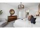 This bright main bedroom has neutral walls, gray carpet and a walk-in closet that leads into the main bath at 1404 W Kennedy Ave, Coolidge, AZ 85128