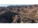 An aerial shot of a desert community nestled against a mountain range at 14052 S 24Th Way, Phoenix, AZ 85048