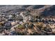 An aerial view of a desert community nestled against a mountain range at 14052 S 24Th Way, Phoenix, AZ 85048