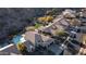 Aerial view of a landscaped property with a swimming pool, patio and beautiful desert landscaping at 14052 S 24Th Way, Phoenix, AZ 85048