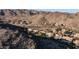 An aerial shot showcases desert homes nestled against a mountain range at 14052 S 24Th Way, Phoenix, AZ 85048