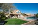 Spacious backyard with lush lawn, pool, and covered patio perfect for outdoor living at 14052 S 24Th Way, Phoenix, AZ 85048