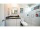 Modern bathroom with a stylish vanity, glass-enclosed shower, and contemporary fixtures at 14052 S 24Th Way, Phoenix, AZ 85048