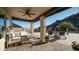 Covered patio with lounge chairs and dining space provides a relaxing outdoor area at 14052 S 24Th Way, Phoenix, AZ 85048