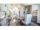 Stylish dining area featuring a chandelier, dining table, and access to other rooms in an open-concept design at 14052 S 24Th Way, Phoenix, AZ 85048