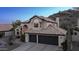 Gorgeous two-story house featuring a three-car garage, and lush landscaping in a serene community at 14052 S 24Th Way, Phoenix, AZ 85048