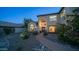 Charming two-story home with a welcoming entrance, attractive landscaping, and a neatly paved walkway at 14052 S 24Th Way, Phoenix, AZ 85048