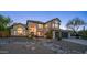 Exterior front view of a well-maintained two-story home with a desert rock garden at 14052 S 24Th Way, Phoenix, AZ 85048