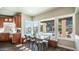 Bright kitchen nook with a view of the pool and a dining table with seating at 14052 S 24Th Way, Phoenix, AZ 85048