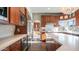 Modern kitchen with stainless steel appliances, white countertops, and wood cabinets at 14052 S 24Th Way, Phoenix, AZ 85048