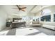 A sprawling main bedroom offers a sitting area, chandelier, and tons of natural light at 14052 S 24Th Way, Phoenix, AZ 85048