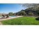 Backyard pool and lush green lawn providing a refreshing outdoor oasis at 14052 S 24Th Way, Phoenix, AZ 85048