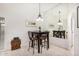 Dining area with a table, four chairs, a mirrored wall, and tile floors at 14209 N Palm Ridge Dr, Sun City, AZ 85351