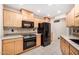 Kitchen featuring modern appliances, granite countertops, and tile backsplash at 14209 N Palm Ridge Dr, Sun City, AZ 85351