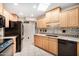 Kitchen with stainless appliances, a tile backsplash, and tile flooring at 14209 N Palm Ridge Dr, Sun City, AZ 85351