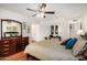 Serene main bedroom boasting ample natural light, ceiling fan, and ensuite access at 14209 N Palm Ridge Dr, Sun City, AZ 85351