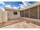 Covered outdoor patio featuring a decorative stone tile floor at 14209 N Palm Ridge Dr, Sun City, AZ 85351