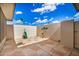 Enclosed patio with decorative artwork and open-air views of the sky at 14209 N Palm Ridge Dr, Sun City, AZ 85351