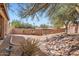 Backyard featuring a rock garden, desert landscaping, and a block wall at 14410 N Silverado Dr, Fountain Hills, AZ 85268