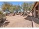 Backyard featuring desert landscaping, a block wall, and a covered patio at 14410 N Silverado Dr, Fountain Hills, AZ 85268