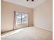 Bright bedroom features neutral walls, carpet, and natural light from a large window at 14410 N Silverado Dr, Fountain Hills, AZ 85268