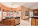 Kitchen featuring a breakfast bar, stainless steel appliances, and tile floors at 14410 N Silverado Dr, Fountain Hills, AZ 85268