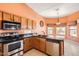 Kitchen featuring granite countertops, stainless steel appliances, and a corner sink with bay window at 14410 N Silverado Dr, Fountain Hills, AZ 85268