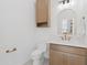 Powder room with vanity, toilet, and white marble countertops at 1523 E Treasure Cove Dr, Gilbert, AZ 85234