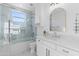 Bathroom featuring a vanity with white marble countertops and a glass enclosed shower at 1523 E Treasure Cove Dr, Gilbert, AZ 85234