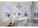 Bright bathroom featuring a soaking tub with adjacent glass enclosed shower at 1523 E Treasure Cove Dr, Gilbert, AZ 85234