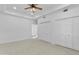 Spacious bedroom with a ceiling fan, carpeted floors, and a closet at 1523 E Treasure Cove Dr, Gilbert, AZ 85234