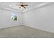 Bedroom with neutral carpet and a large window at 1523 E Treasure Cove Dr, Gilbert, AZ 85234