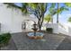 Elegant courtyard view showcases a tiered fountain, lush landscaping, and direct access to the home's interior at 1523 E Treasure Cove Dr, Gilbert, AZ 85234