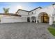 Expansive driveway provides ample parking space in front of a home with a convenient three-car garage at 1523 E Treasure Cove Dr, Gilbert, AZ 85234