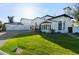 Beautifully landscaped front yard leads to the impressive facade of this luxury property with large windows at 1523 E Treasure Cove Dr, Gilbert, AZ 85234