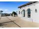 Exterior features a rooftop deck with wrought iron fence, stucco walls, and arch windows at 1523 E Treasure Cove Dr, Gilbert, AZ 85234