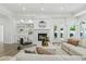 Cozy living room featuring a fireplace, built-in shelves, and a neutral color palette at 1523 E Treasure Cove Dr, Gilbert, AZ 85234